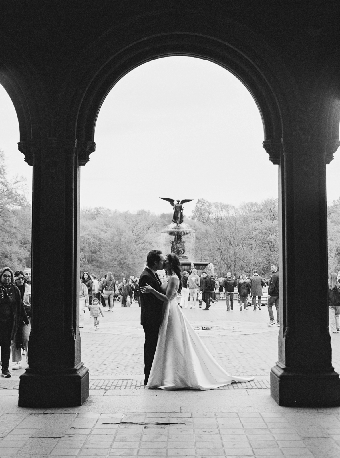 Bride + Groom kissing at Bethesda Terrace